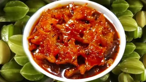Malaysian spiced fruit pickle being cooked in a wok in a home kitchen
